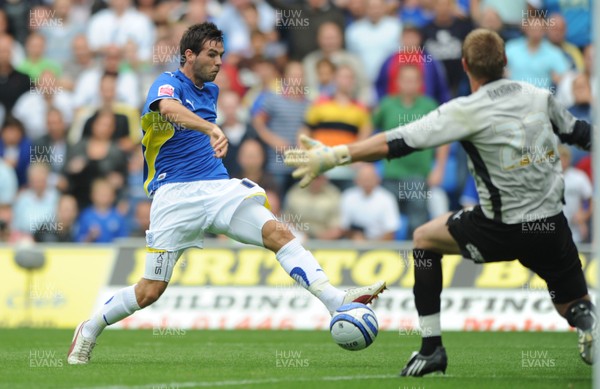23.08.09 - Cardiff City v Bristol City - Coca-Cola Championship - Joe Ledley of Cardiff City takes on Dean Gerken of Bristol City. 