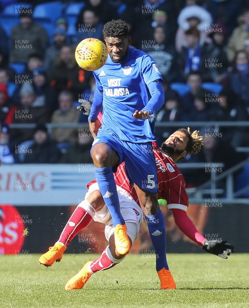 250218 - Cardiff City v Bristol City, Sky Bet Championship - Bruno Ecuele Manga of Cardiff City and Lois Diony of Bristol City compete for the ball