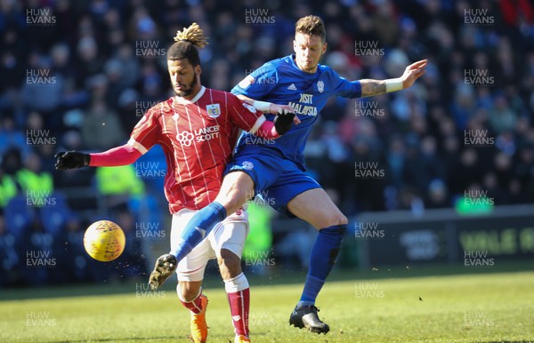 250218 - Cardiff City v Bristol City, Sky Bet Championship - Greg Halford of Cardiff City challenges Lois Diony of Bristol City