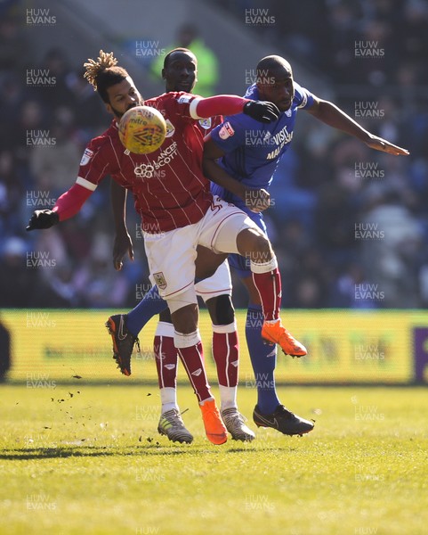 250218 - Cardiff City v Bristol City, Sky Bet Championship - Sol Bamba of Cardiff City and Lois Diony of Bristol City compete for the ball