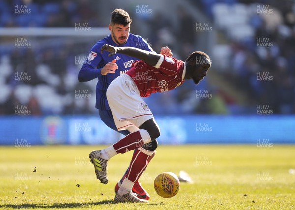 250218 - Cardiff City v Bristol City, Sky Bet Championship - Callum Paterson of Cardiff City and Famara Diedhiou of Bristol City compete for the ball