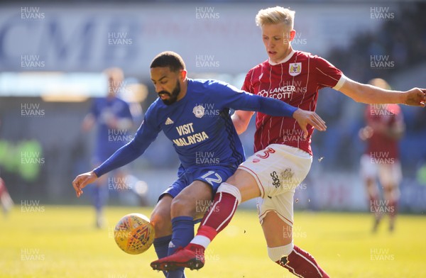 250218 - Cardiff City v Bristol City, Sky Bet Championship - Liam Feeney of Cardiff City is challenged by Hordur Magnusson of Bristol City