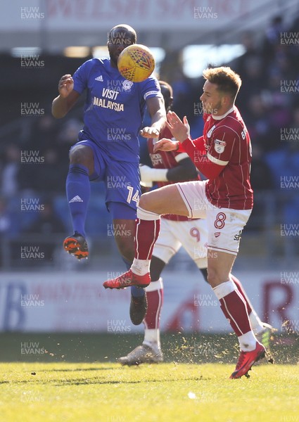 250218 - Cardiff City v Bristol City, Sky Bet Championship - Sol Bamba of Cardiff City and Josh Brownhill of Bristol City compete for the ball