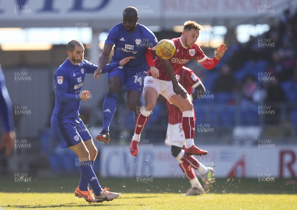 250218 - Cardiff City v Bristol City, Sky Bet Championship - Sol Bamba of Cardiff City and Josh Brownhill of Bristol City compete for the ball