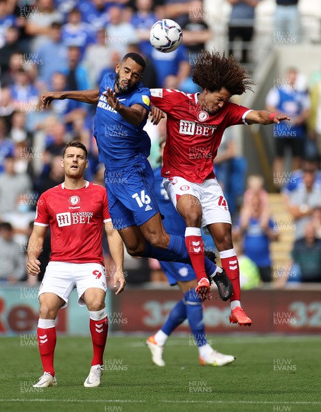 280821 - Cardiff City v Bristol City - SkyBet Championship - Curtis Nelson of Cardiff City and Han-Noah Massengo of Bristol City go up for the ball