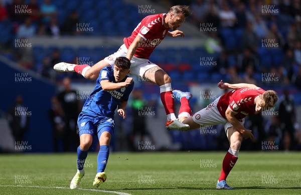 280821 - Cardiff City v Bristol City - SkyBet Championship - Nathan Baker of Bristol City goes over Ryan Giles of Cardiff City