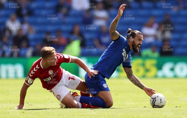 280821 - Cardiff City v Bristol City - SkyBet Championship - Marlon Pack of Cardiff City is tackled by Cameron Pring of Bristol City