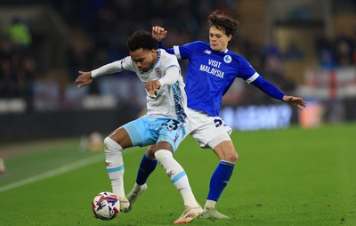 040325 Cardiff City v Burnley, EFL Sky Bet Championship - Lucas Pires of Burnley holds off Perry Ng of Cardiff City