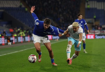 040325 Cardiff City v Burnley, EFL Sky Bet Championship - Rubin Colwill of Cardiff City and Jeremy Sarmiento of Burnley compete for the ball