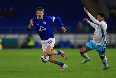 040325 Cardiff City v Burnley, EFL Sky Bet Championship - Rubin Colwill of Cardiff City gets away from Josh Laurent of Burnley