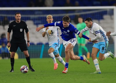 040325 Cardiff City v Burnley, EFL Sky Bet Championship - Rubin Colwill of Cardiff City holds off Josh Brownhill of Burnley