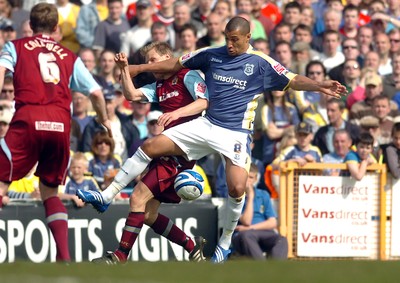 13.04.09 - Championship Football -  Cardiff City v Burnley -  Cardiff's Jay Bothroyd is tackled by Burnley's Christian Kalvenes 
