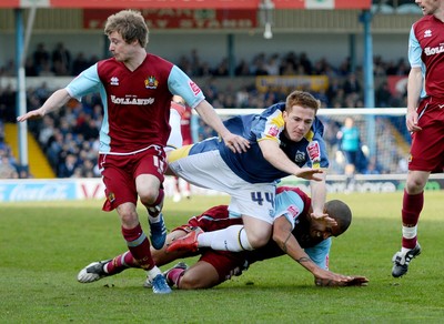 13.04.09 - Championship Football -  Cardiff City v Burnley -  Cardiff's Ross McCormack is brought down by Burnley's Clarke Carlisle (on floor) with Burnley's Wade Elliott on L 