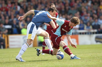 13.04.09.. Cardiff City v Burnley, Coca Cola Championship -  Burnley's Wade Elliott is brought down by Cardiff's Gavin Rae 