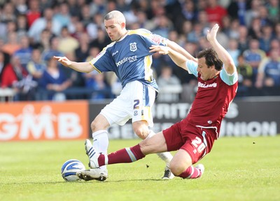 13.04.09.. Cardiff City v Burnley, Coca Cola Championship -  Cardiff's Kevin McNaughton is tackled by Burnley's Robbie Blake  