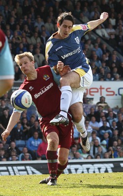 13.04.09.. Cardiff City v Burnley, Coca Cola Championship -  Cardiff's Peter Whittingham gets a shot in as Burnley's Christian Kalvenes  challenges 