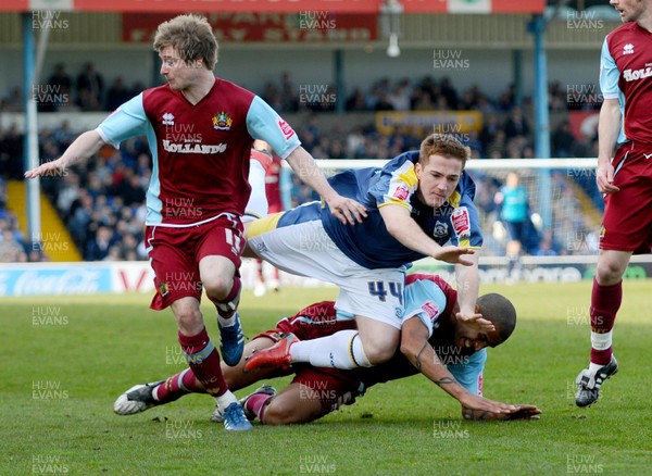 13.04.09 - Championship Football -  Cardiff City v Burnley -  Cardiff's Ross McCormack is brought down by Burnley's Clarke Carlisle (on floor) with Burnley's Wade Elliott on L 