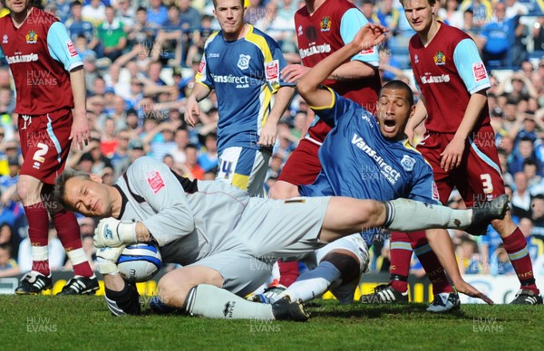 13.04.09 - Championship Football -  Cardiff City v Burnley -  Burnley 'keeper Brian Jensen gets to the ball as Cardiff's Jay Bothroyd challenges 
