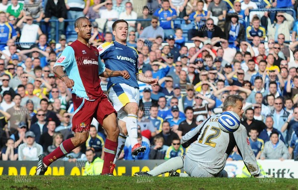 13.04.09 - Championship Football -  Cardiff City v Burnley -  Cardiff's Ross McCormack beats Burnley 'keeper Brian Jensen to score his second goal(Cardiff's third) as Clarke Carlisle looks on 