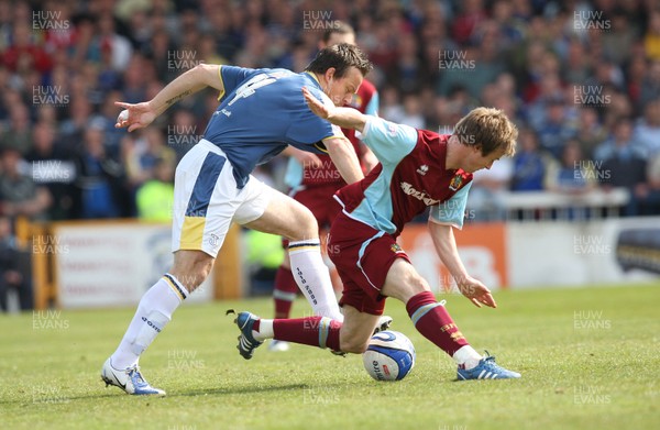 13.04.09.. Cardiff City v Burnley, Coca Cola Championship -  Burnley's Wade Elliott is brought down by Cardiff's Gavin Rae 