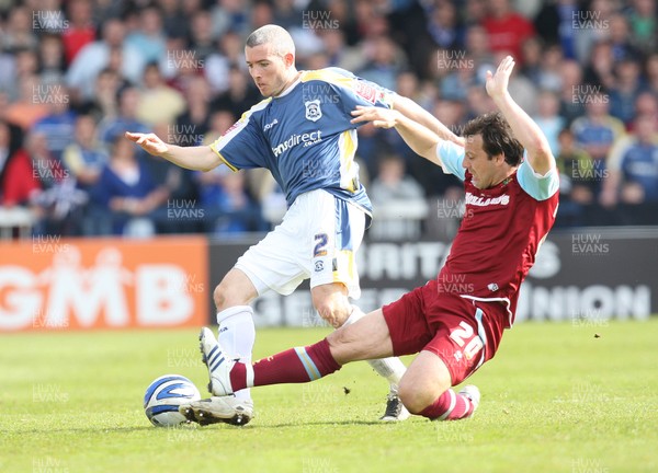 13.04.09.. Cardiff City v Burnley, Coca Cola Championship -  Cardiff's Kevin McNaughton is tackled by Burnley's Robbie Blake  