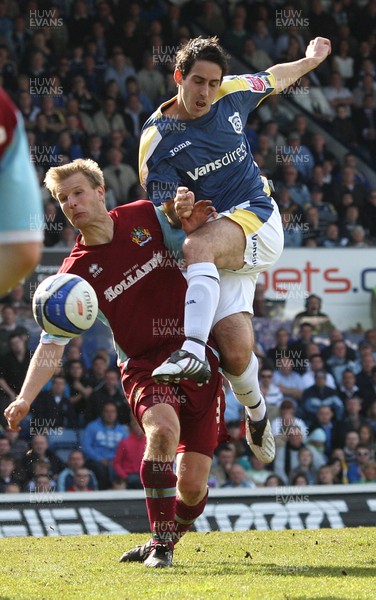 13.04.09.. Cardiff City v Burnley, Coca Cola Championship -  Cardiff's Peter Whittingham gets a shot in as Burnley's Christian Kalvenes  challenges 