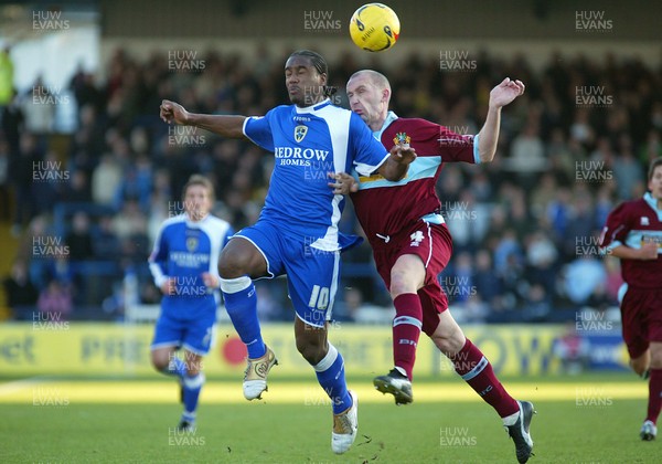 140106Cardiff City v Burnley Cardiff's Cameron Jerome is challenged by John McGreal  