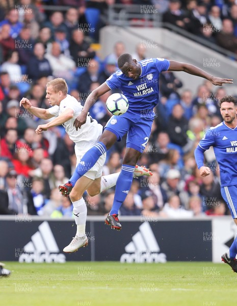 300918 - Cardiff City v Burnley, Premier League - Sol Bamba of Cardiff City wins the ball from Matej Vydra of Burnley