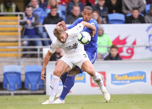 300918 - Cardiff City v Burnley, Premier League - Kenneth Zohore of Cardiff City and Charlie Taylor of Burnley compete for the ball