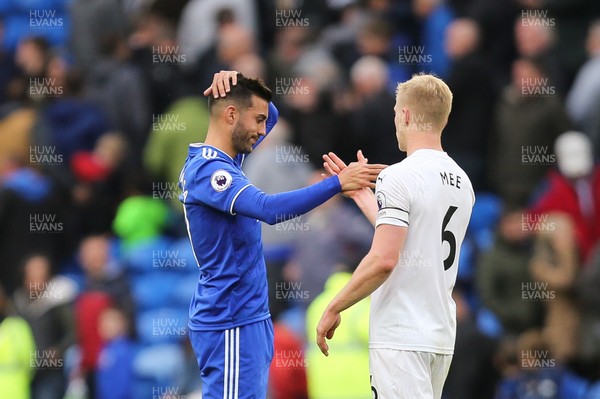 300918 - Cardiff City v Burnley, Premier League - Victor Camarasa of Cardiff City with Ben Mee of Burnley at the end of the game