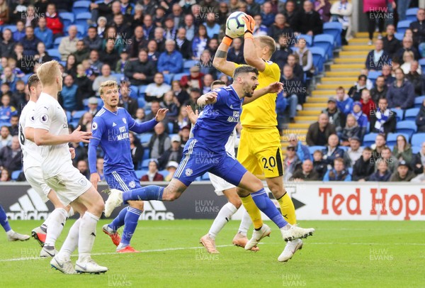 300918 - Cardiff City v Burnley, Premier League - Burnley goalkeeper Joe Hart claims the ball as Callum Paterson of Cardiff City races in to challenge