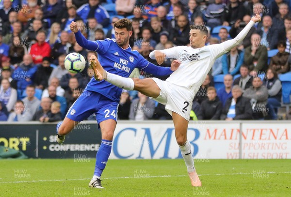 300918 - Cardiff City v Burnley, Premier League - Gary Madine of Cardiff City and Matthew Lowton of Burnley compete for the ball