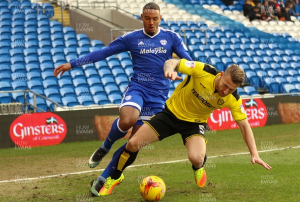 210117 - Cardiff City v Burton Albion, Sky Bet Championship - Kenneth Zohore of Cardiff City and Kyle McFadzean of Burton Albion compete for the ball