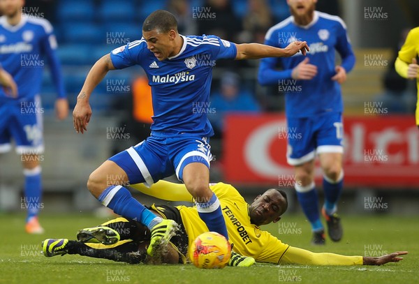 210117 - Cardiff City v Burton Albion, Sky Bet Championship - Lee Peltier of Cardiff City is tackled by Lucas Akins of Burton Albion