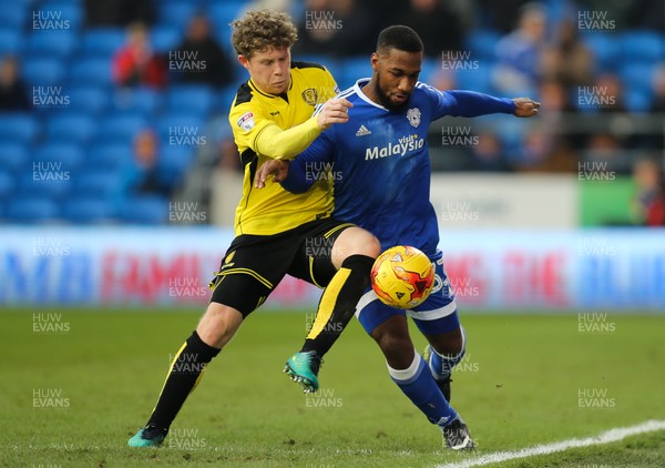 210117 - Cardiff City v Burton Albion, Sky Bet Championship - Junior Hoilett of Cardiff City is challenged by Matt Palmer of Burton Albion