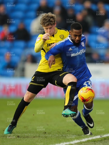 210117 - Cardiff City v Burton Albion, Sky Bet Championship - Junior Hoilett of Cardiff City is challenged by Matt Palmer of Burton Albion