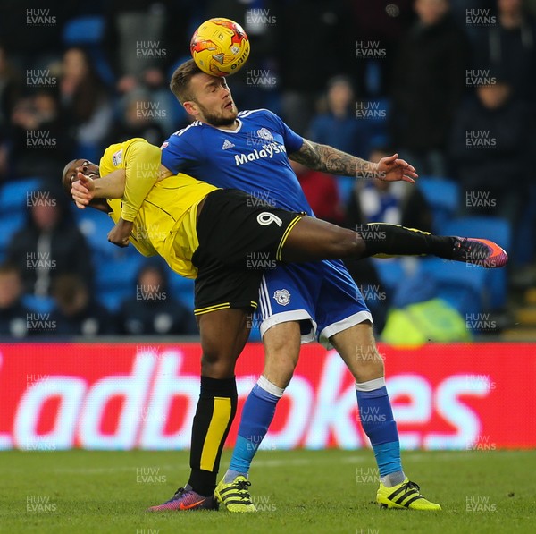 210117 - Cardiff City v Burton Albion, Sky Bet Championship - Joe Ralls of Cardiff City and Marvin Sordell of Burton Albion compete for the ball