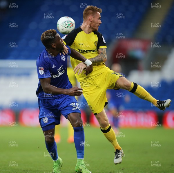 220817 - Cardiff City v Burton Albion, Carabao Cup Round 2 - Omar Bogle of Cardiff City and Tom Naylor of Burton Albion compete for the ball