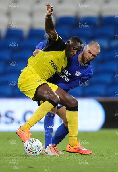 220817 - Cardiff City v Burton Albion, Carabao Cup Round 2 - Lucas Akins of Burton Albion holds off the challenge of Matthew Connolly of Cardiff City