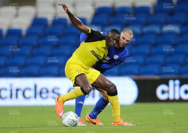 220817 - Cardiff City v Burton Albion, Carabao Cup Round 2 - Lucas Akins of Burton Albion holds off the challenge of Matthew Connolly of Cardiff City