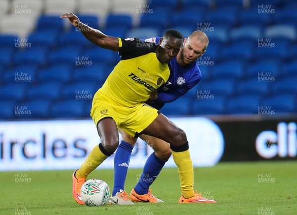 220817 - Cardiff City v Burton Albion, Carabao Cup Round 2 - Lucas Akins of Burton Albion holds off the challenge of Matthew Connolly of Cardiff City