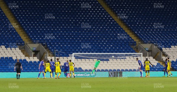 220817 - Cardiff City v Burton Albion, Carabao Cup Round 2 - Ben Fox of Burton Albion beats Cardiff City goalkeeper Brian Murphy to score the second goal in front of an empty stand