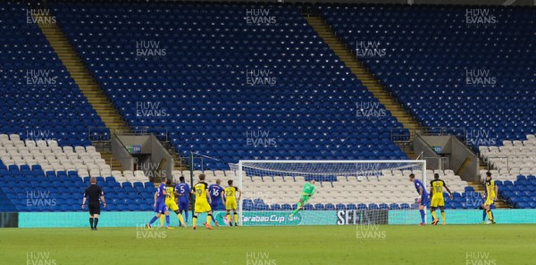 220817 - Cardiff City v Burton Albion, Carabao Cup Round 2 - Ben Fox of Burton Albion beats Cardiff City goalkeeper Brian Murphy to score the second goal in front of an empty stand