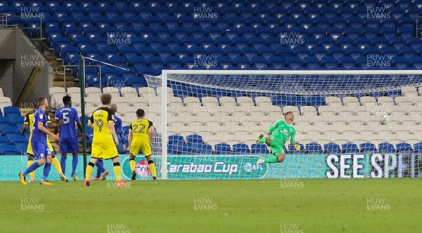 220817 - Cardiff City v Burton Albion, Carabao Cup Round 2 - Ben Fox of Burton Albion beats Cardiff City goalkeeper Brian Murphy to score the second goal in front of an empty stand