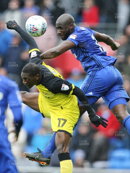 300318 - Cardiff City v Burton Albion, Sky Bet Championship - Sol Bamba of Cardiff City gets above Marvin Sordell of Burton Albion to win the ball