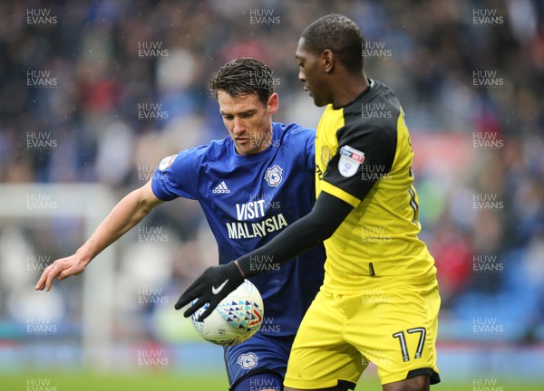 300318 - Cardiff City v Burton Albion, Sky Bet Championship - Craig Bryson of Cardiff City and Marvin Sordell of Burton Albion compete for the ball