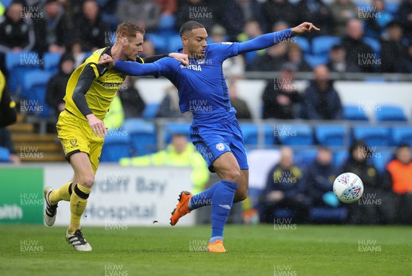 300318 - Cardiff City v Burton Albion, Sky Bet Championship - Kenneth Zohore of Cardiff City is challenged by Tom Naylor of Burton Albion