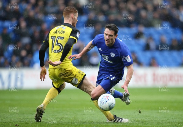 300318 - Cardiff City v Burton Albion, Sky Bet Championship - Craig Bryson of Cardiff City is brought down by Tom Naylor of Burton Albion
