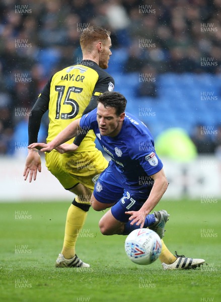300318 - Cardiff City v Burton Albion, Sky Bet Championship - Craig Bryson of Cardiff City is brought down by Tom Naylor of Burton Albion