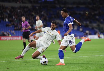 300925 - Cardiff City v Burton Albion, EFL Sky Bet League 1 - Chris Willock of Cardiff City is challenged by Kyran Lofthouse of Burton Albion